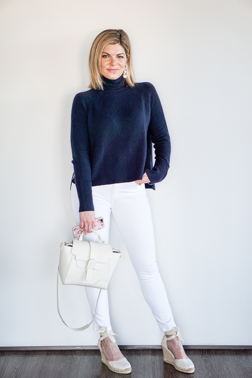 navy turtleneck with white jeans