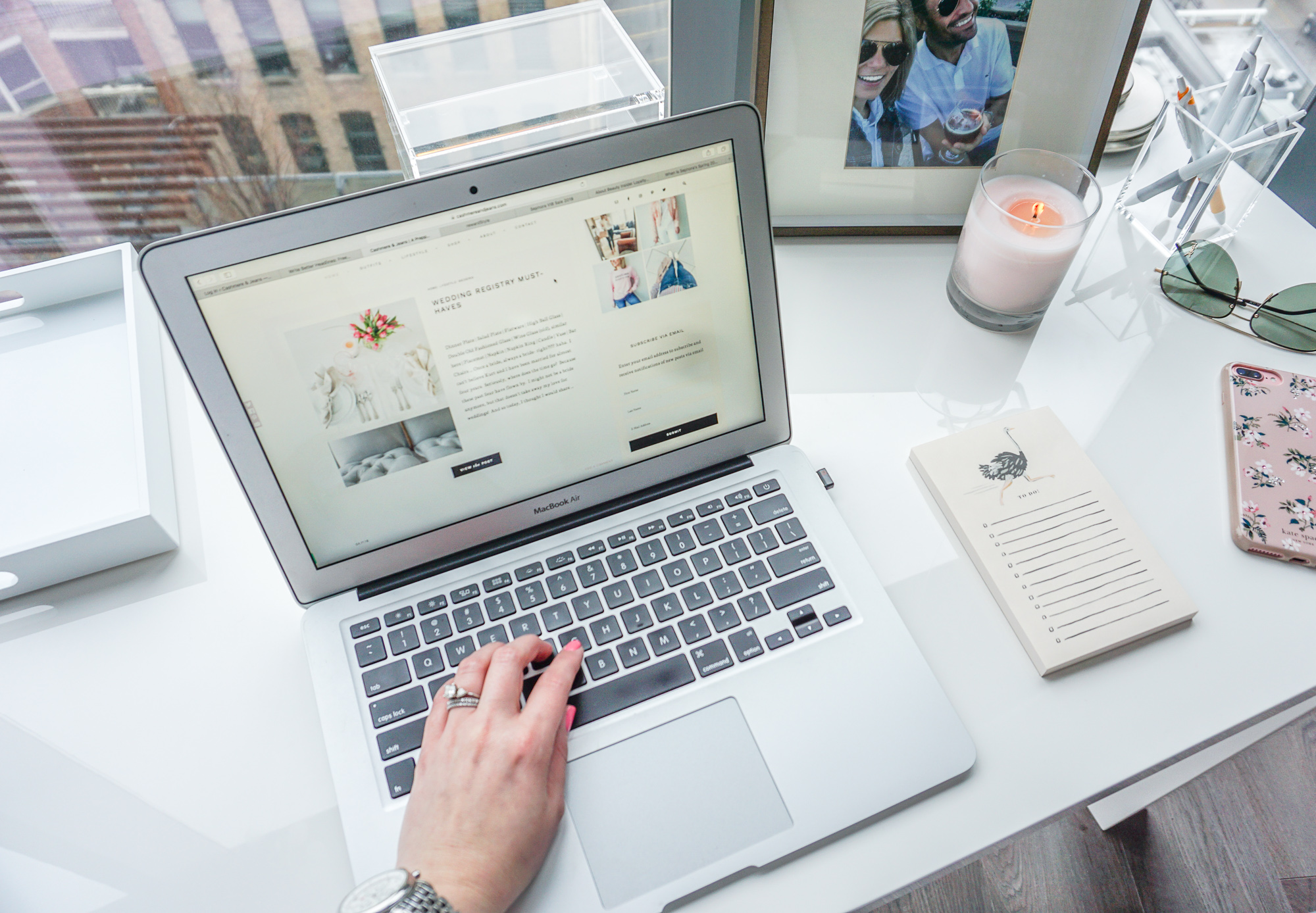 MAC computer and a white desk