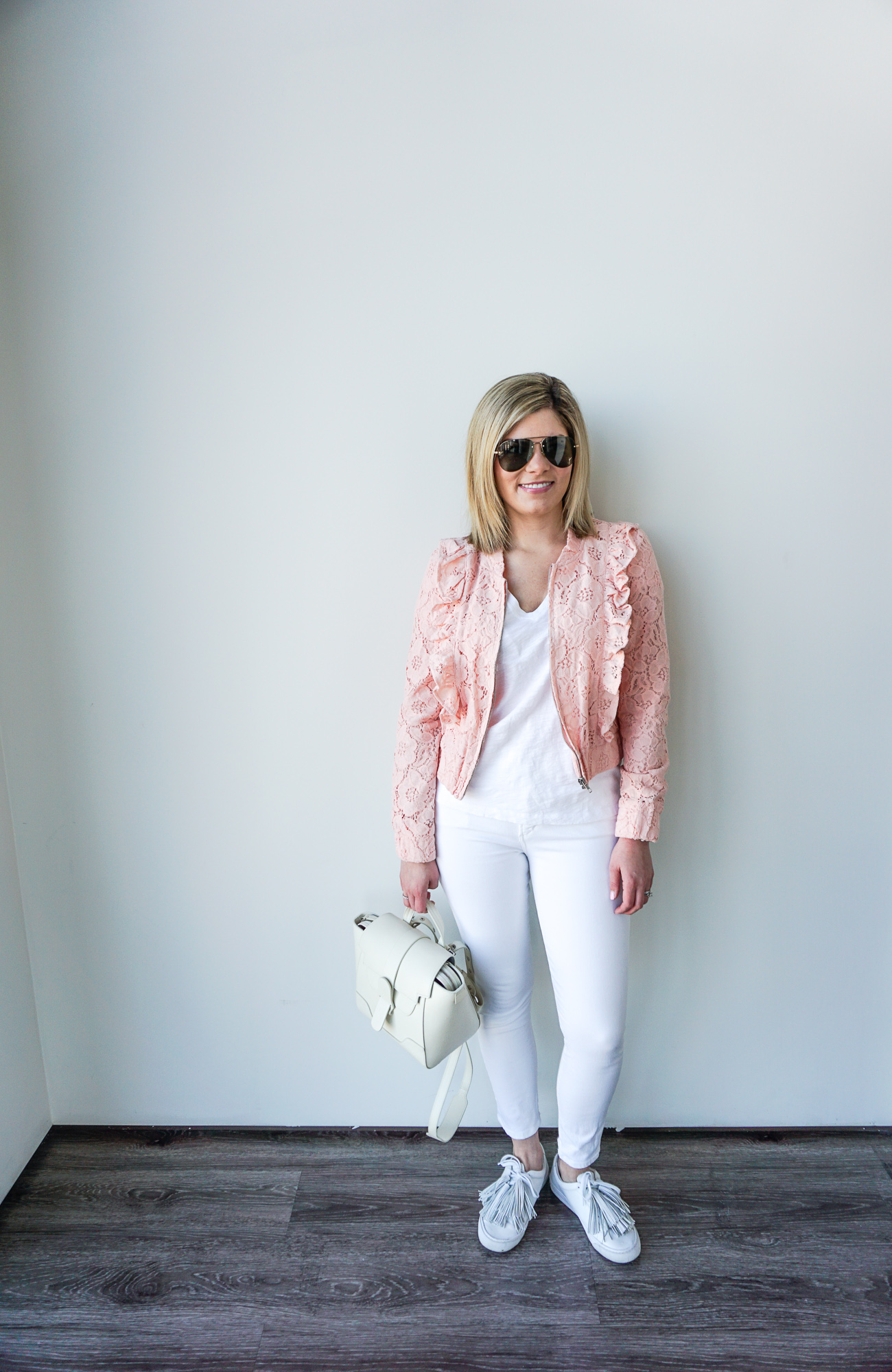 white jeans and pink bomber jacket