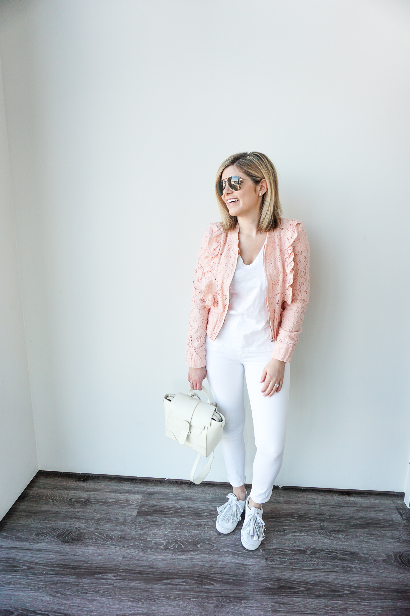 white jeans and bomber jacket