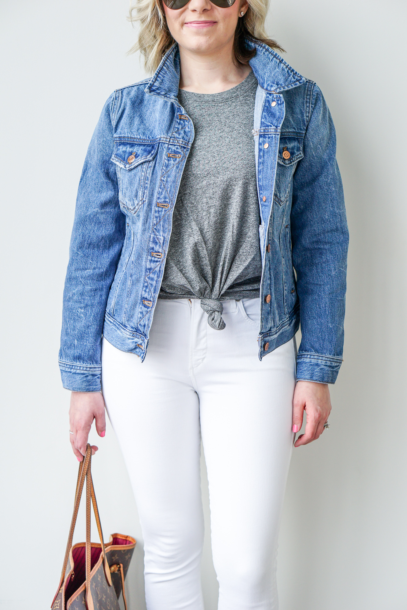 jean jacket and grey knotted t-shirt
