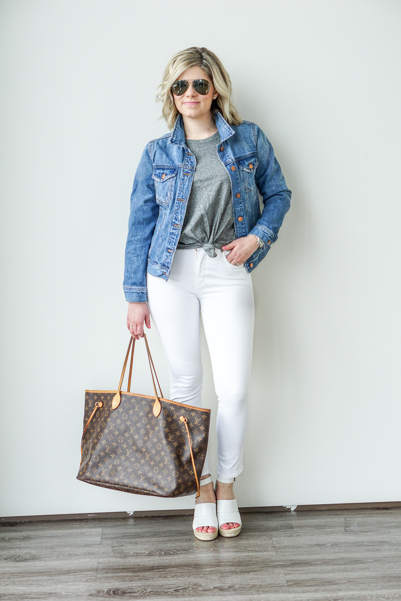 grey t-shirt and white jeans